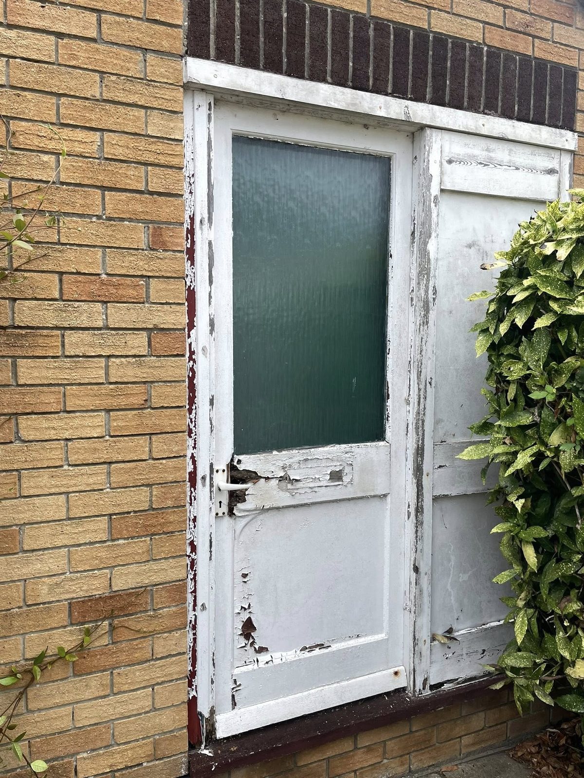 Old external side door before replacement