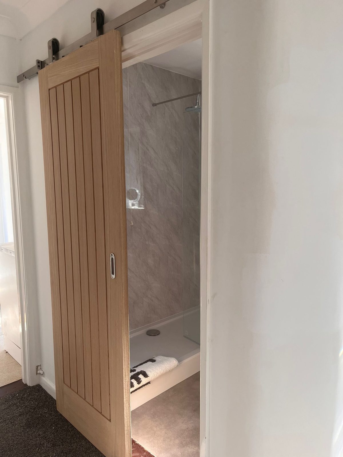 Sliding barn door fitted by LS Interiors